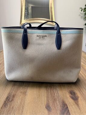 kate spade cream canvas tote with navy trim and light blue stripe